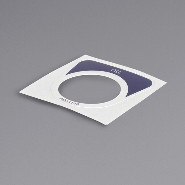 A white and blue rectangular plastic piece with a circle cut out.