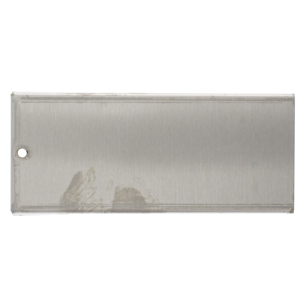 A rectangular metal plate with a hole in it.