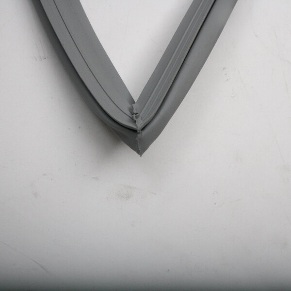 A close-up of a grey rubber corner with a v shape.