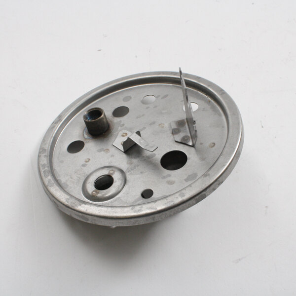 A metal circular tank cover with holes and screws.