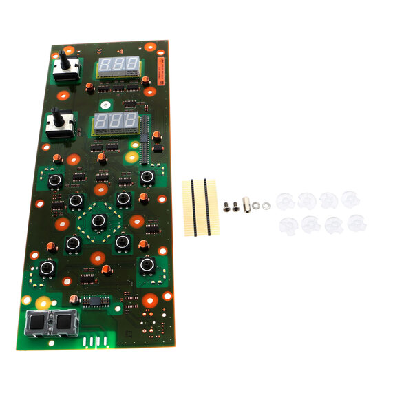 A green circuit board with many small round objects.