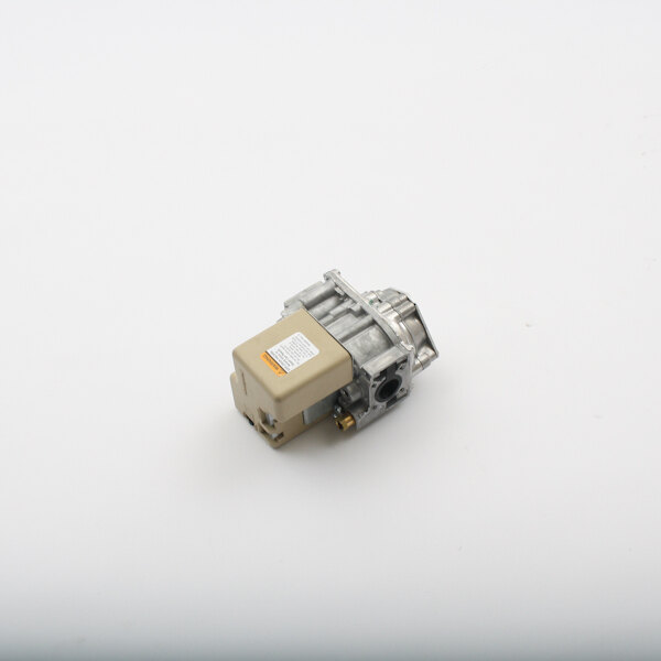 A small metal BKI gas valve with a square tan object on a white background.