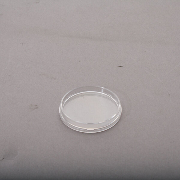 An Accutemp 2 inch clear plastic lens cover in packaging.