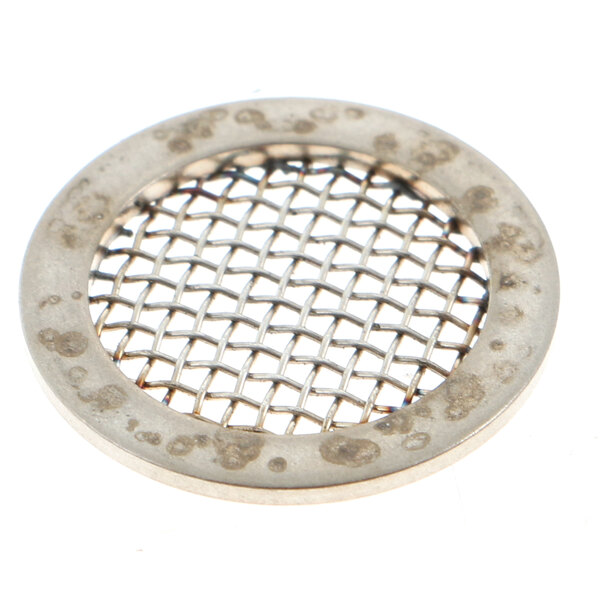 A circular metal object with a mesh pattern.