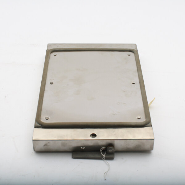 A metal box with a hole in the middle and a metal plate with screws on the Crown Steam 8-5076-9 Door Assembly.