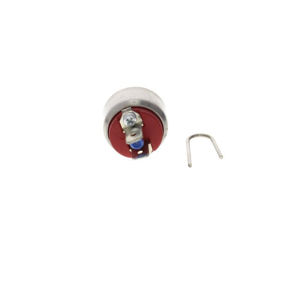 A round metal Henny Penny pressure switch with a red cap.