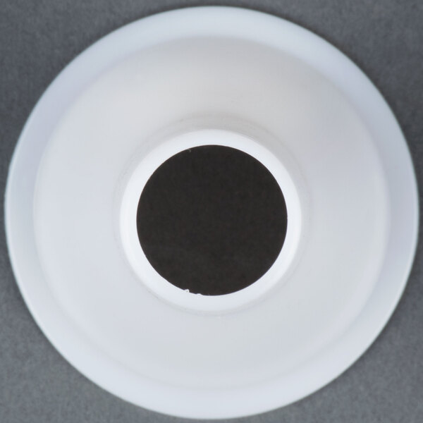 A white plastic sausage stuffer tube with a black circle at the end.