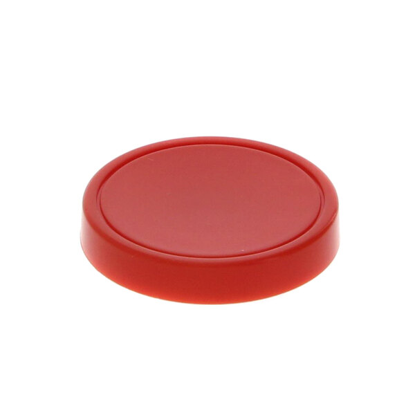 A red plastic disc cap with a white background.