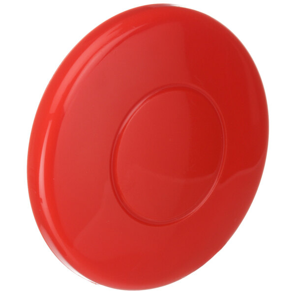 A red mushroom button with a hole in the center.