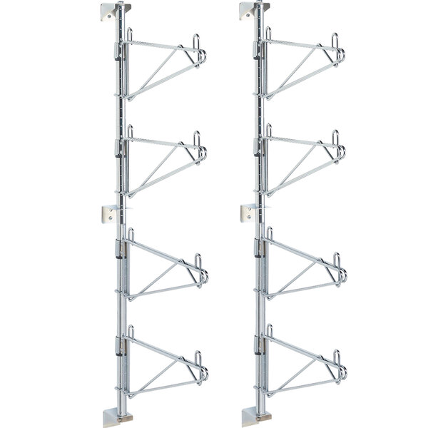Two Metro chrome metal racks for wall mounting with four hooks on each side.