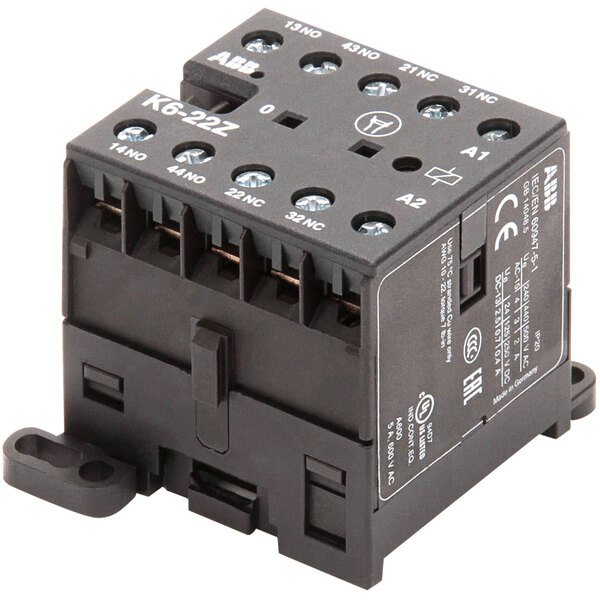 A black Stero relay box with white text on it and four switches.