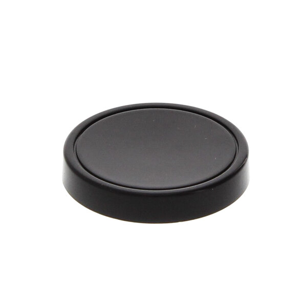 A black circular disc cap on a white background.