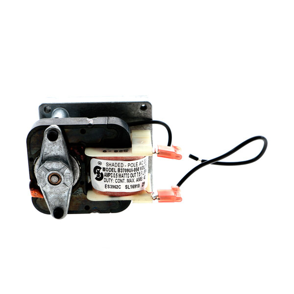 A small metal electric motor with a label and wires.