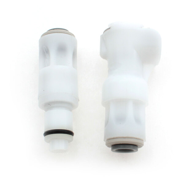 Two white plastic quick disconnects with one on top.