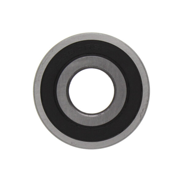 A circular metal ball bearing with a hole in the middle.