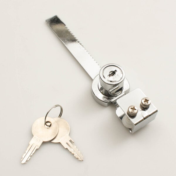 A metal key with a key ring inserted into a Master-Bilt door lock.