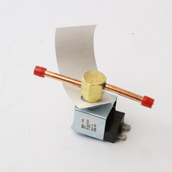 A Delfield 120v water solenoid coil with a piece of paper attached to it.