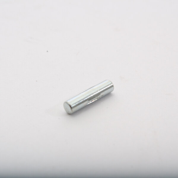 A silver metal Berkel pin on a white surface.