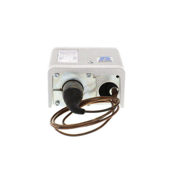 A white Randell control box with a brown wire.
