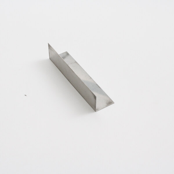 A metal bar on a white surface.