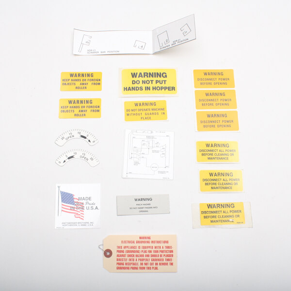 An Anets label kit with a bunch of different stickers, labels, and warning signs.