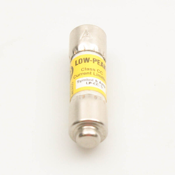 A close-up of a yellow and silver Blodgett fuse with a white label.