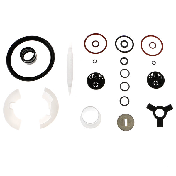 A black circular object with holes and a group of different sizes of round black and white objects, including a black circle with holes.