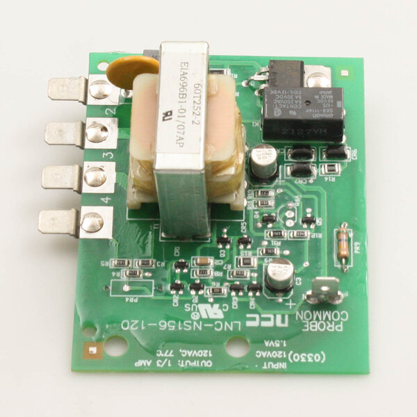 A green Groen control low level circuit board with a small square object.