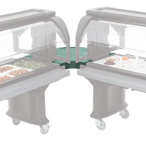 A green Cambro corner connector on a table with food trays.