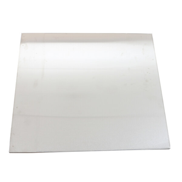 A white square metal panel with a black spot on it.