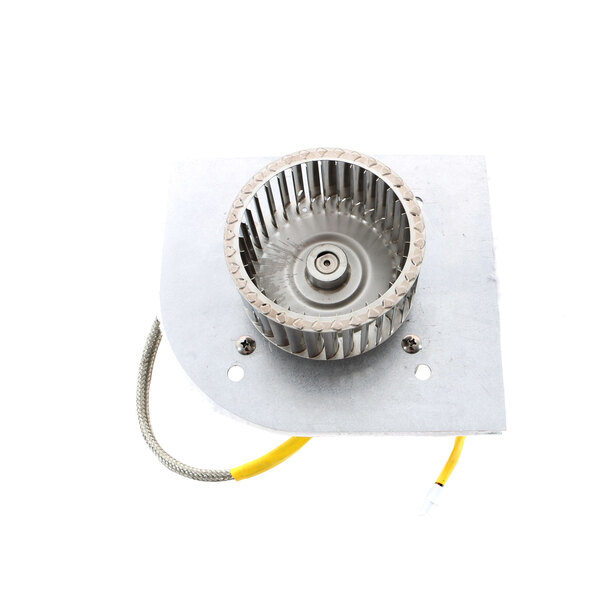 A metal TurboChef blower motor wheel with a wire attached.