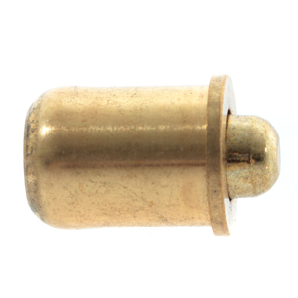 A close-up of a brass cylinder with a metal object inside.
