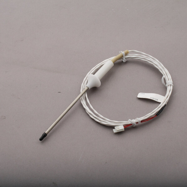 A white wire with a metal rod on the end and a small white connector.
