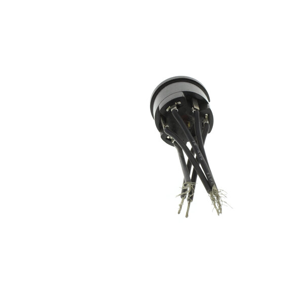 A close-up of a black and white Klixon plug.