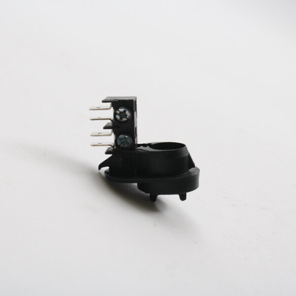 A black Cadco KRP-16 Terminating Connector with a screw on it on a white surface.