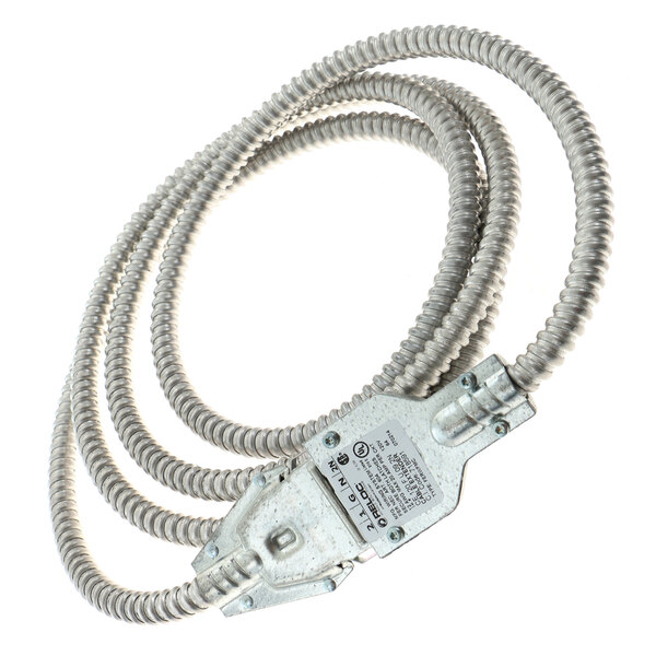A close-up of a metal Delfield cable with a metal connector.