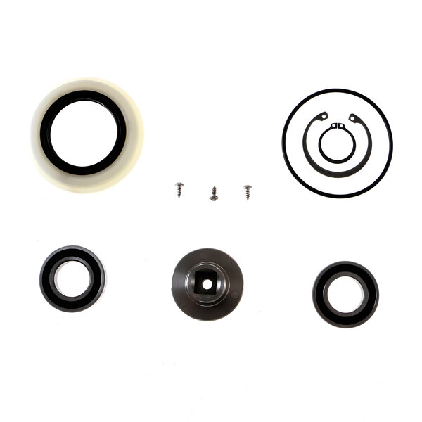 A white and black rubber shaft plate with round rubber seals and washers.