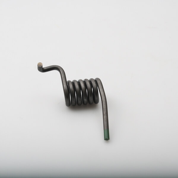 A BKI Torsion Spring with a green metal handle on a white surface.