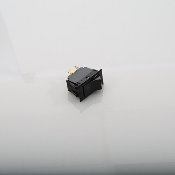 A black square Berkel rocker switch with a gold pin on top.
