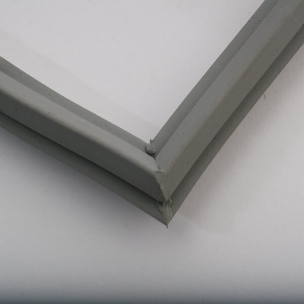 A close-up of a grey plastic corner piece.