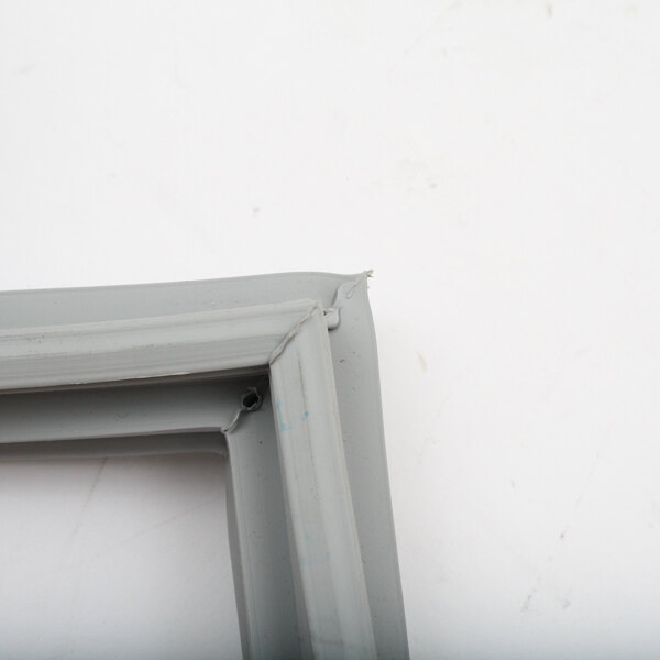 A close-up of a grey Randell gasket frame with a screw.