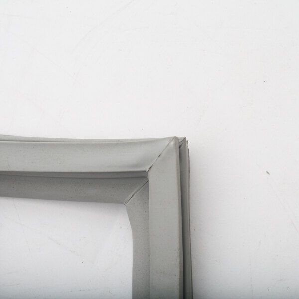 A close up of a grey Randell refrigeration gasket frame on a white surface.