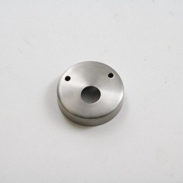 A round silver metal end cap with holes.