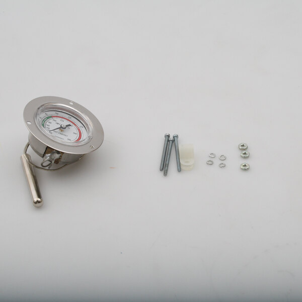 A close-up of a Cres Cor thermometer with screws and a white face.
