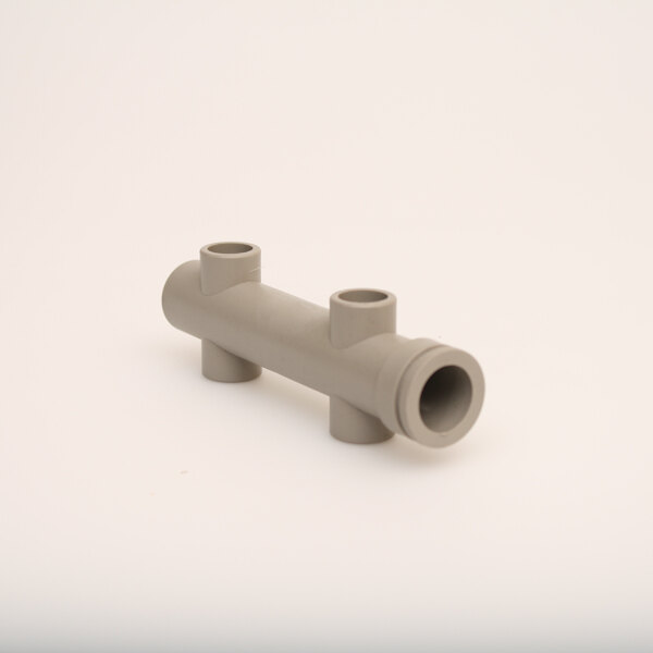 A gray plastic Scotsman manifold with two holes.