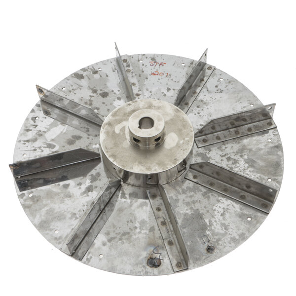 A Doyon Baking Equipment metal circular fan blade with holes.