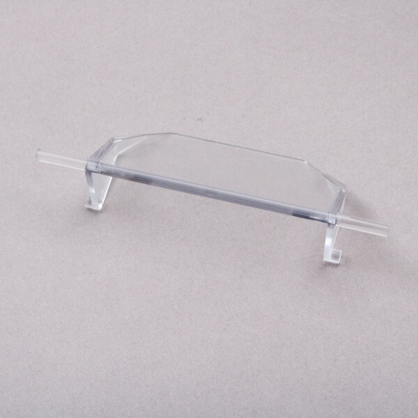 A clear plastic Scotsman Chute Flap with a clear plastic handle.