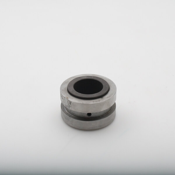 A round metal Baxter Main Bearing with a hole in it.