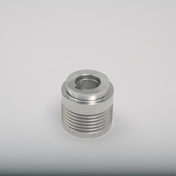 A silver metal cylinder with a threaded hole.