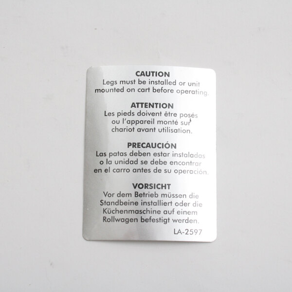 A silver metal tag with the words "caution" and "caution" on a white card.